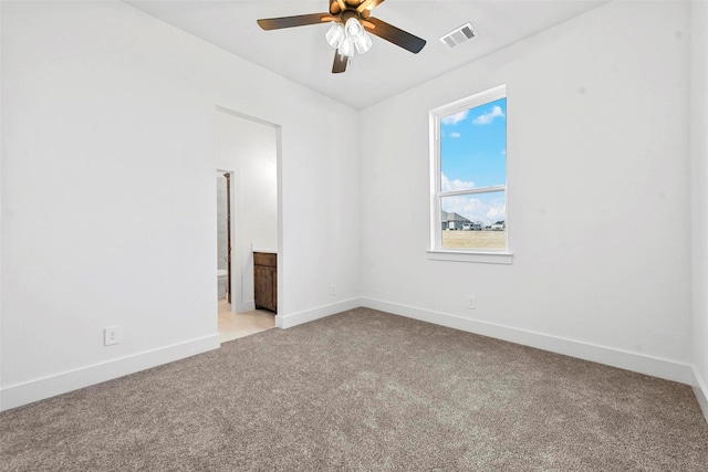 empty room with light colored carpet and ceiling fan