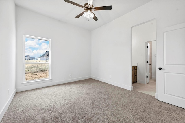 empty room with light carpet and ceiling fan