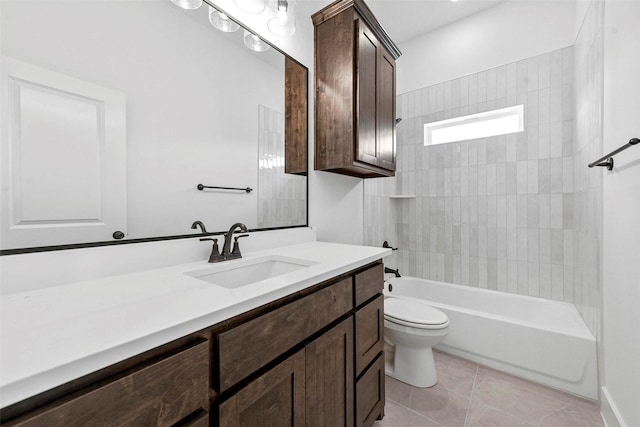 full bathroom with vanity, tile patterned flooring, toilet, and tiled shower / bath