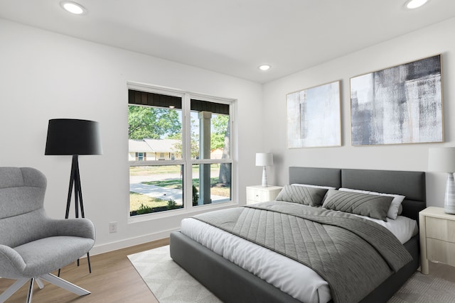 bedroom with light hardwood / wood-style flooring