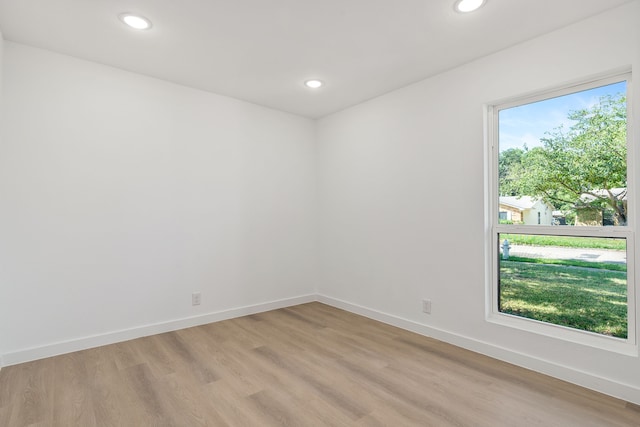 unfurnished room with light hardwood / wood-style flooring