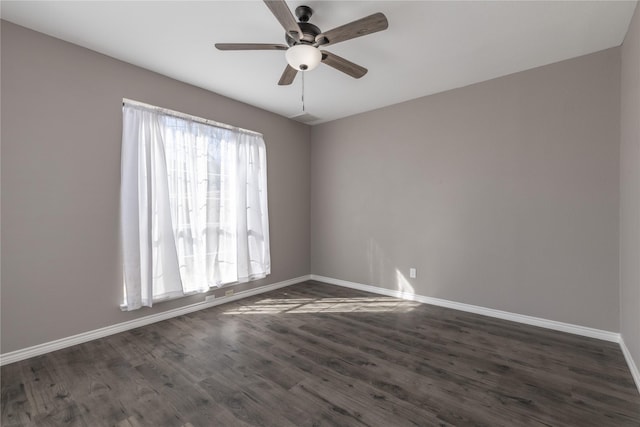 unfurnished room with dark wood-type flooring and ceiling fan