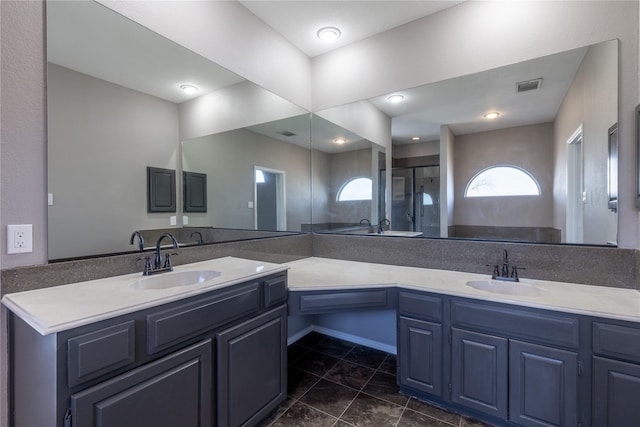 bathroom featuring walk in shower and vanity