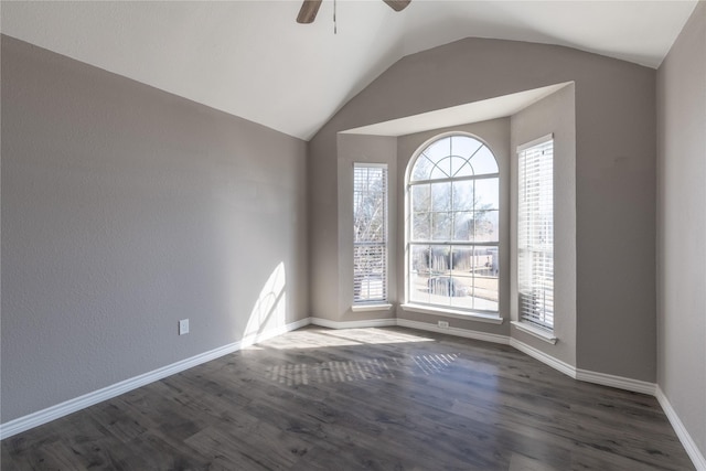 unfurnished room featuring dark wood-type flooring, ceiling fan, and vaulted ceiling