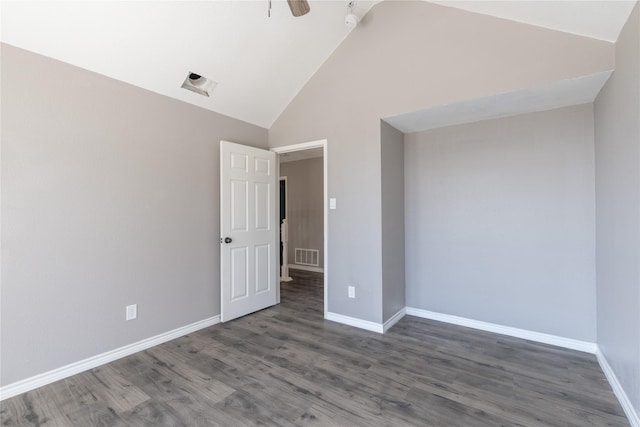 spare room featuring ceiling fan, dark hardwood / wood-style floors, and high vaulted ceiling