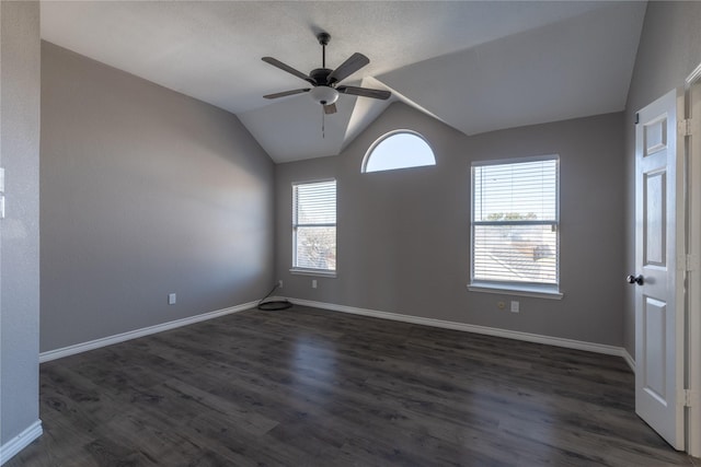 unfurnished room featuring dark wood-type flooring, ceiling fan, and lofted ceiling