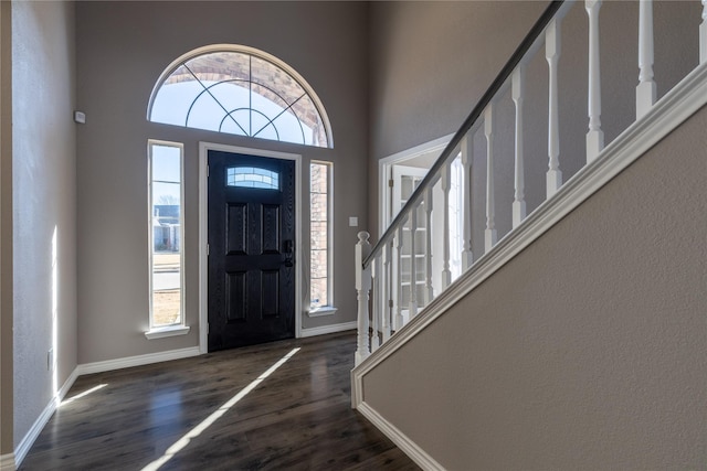 entrance foyer featuring dark hardwood / wood-style floors