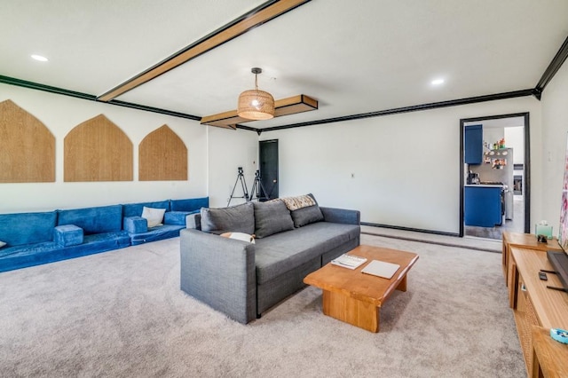 living room with ornamental molding and light carpet