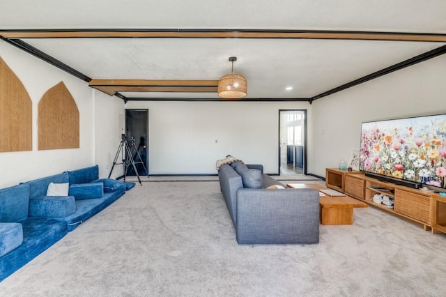 carpeted living room with ornamental molding