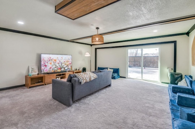 living room featuring crown molding, carpet floors, and a textured ceiling