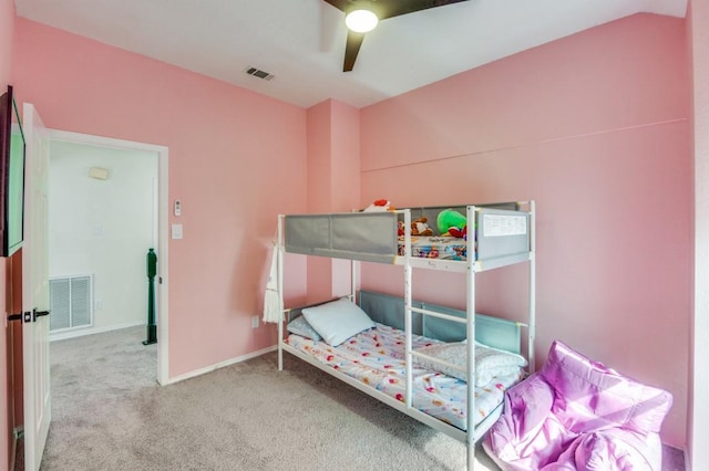 bedroom with ceiling fan, vaulted ceiling, and carpet