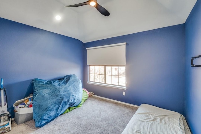 bedroom featuring ceiling fan, lofted ceiling, and carpet floors