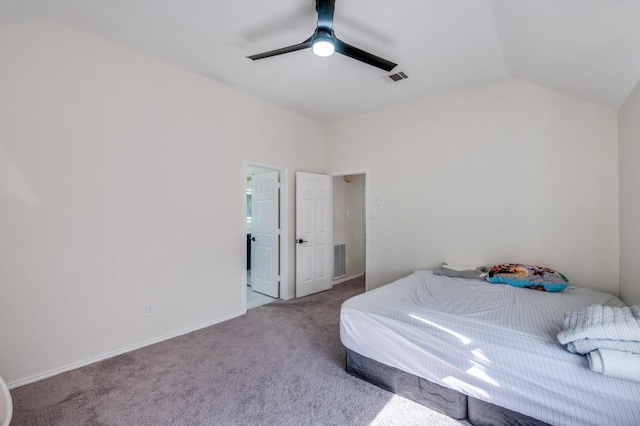 bedroom with lofted ceiling, light carpet, and ceiling fan