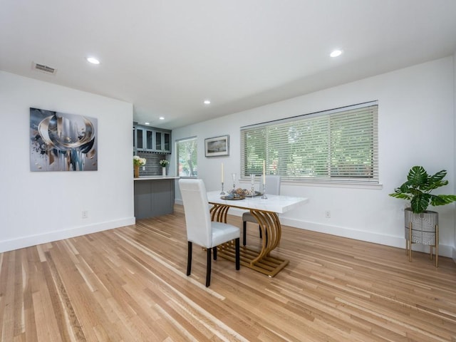 dining area with light hardwood / wood-style flooring