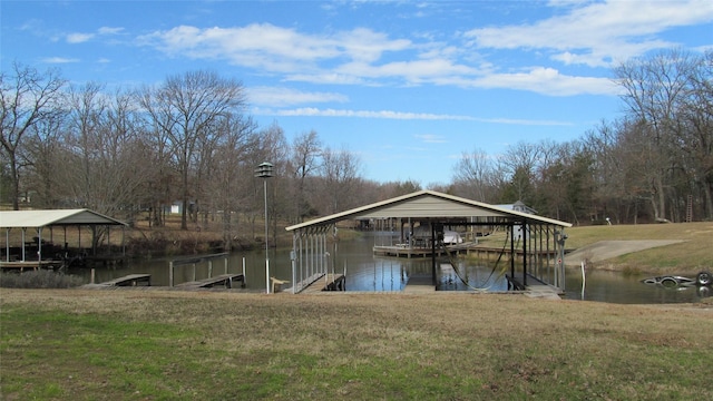 dock area with a water view and a lawn