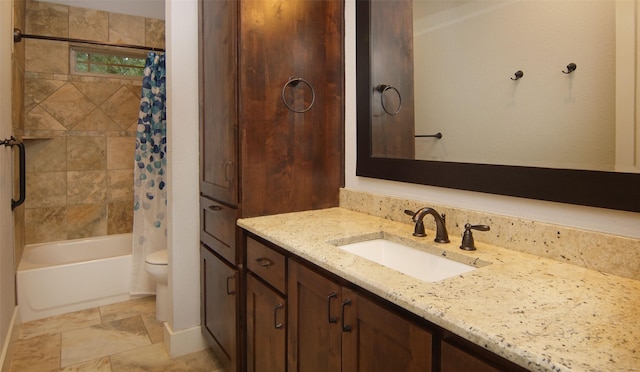 full bathroom with vanity, shower / tub combo with curtain, and toilet