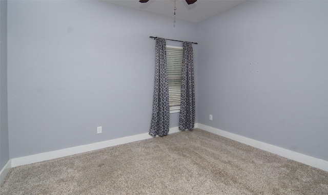 carpeted empty room featuring ceiling fan