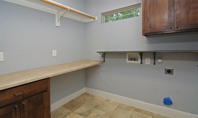 laundry area featuring cabinets, hookup for a washing machine, hookup for an electric dryer, and hookup for a gas dryer