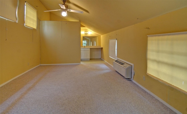 bonus room featuring lofted ceiling, a wall unit AC, light colored carpet, and ceiling fan