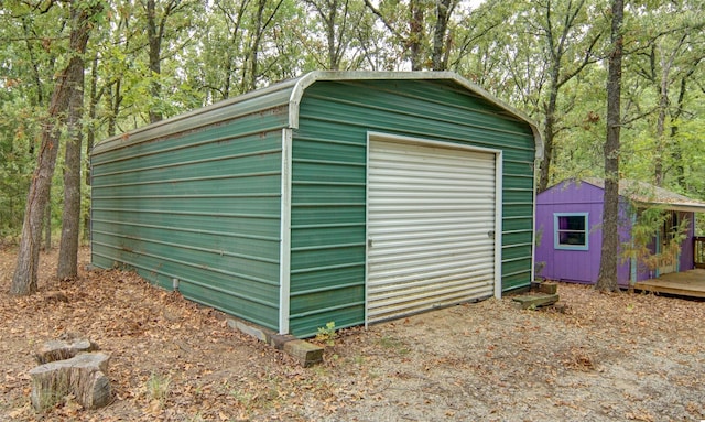 view of outbuilding featuring a garage