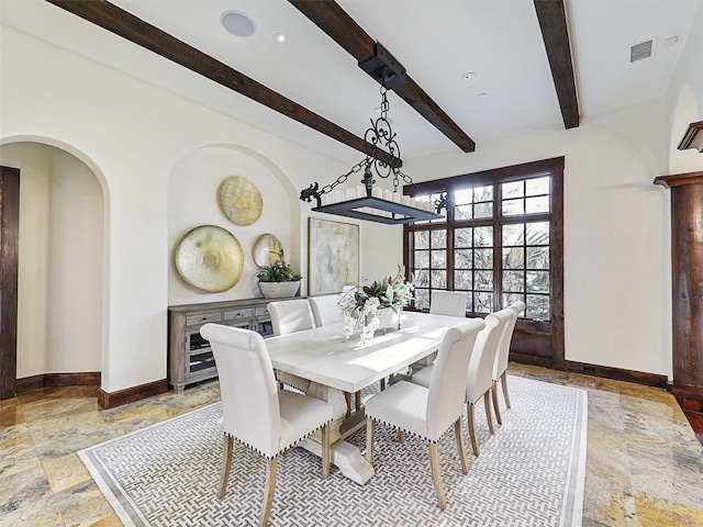 dining room with beamed ceiling