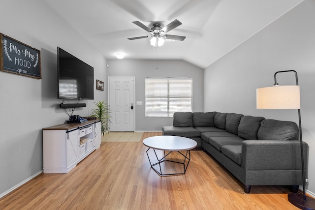 living room with ceiling fan, lofted ceiling, and light hardwood / wood-style floors