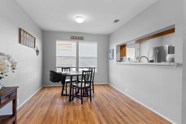 dining area with light hardwood / wood-style flooring