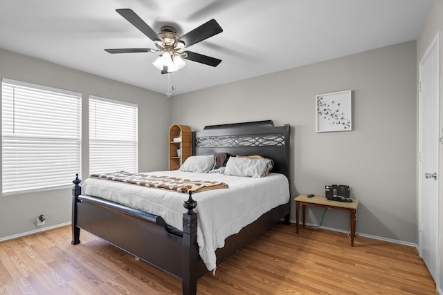 bedroom featuring hardwood / wood-style flooring and ceiling fan