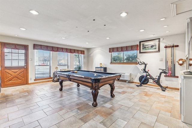 game room featuring pool table, plenty of natural light, and a wall unit AC