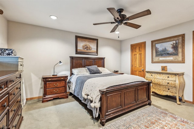 bedroom with light colored carpet and ceiling fan