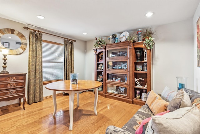 home office with light hardwood / wood-style floors