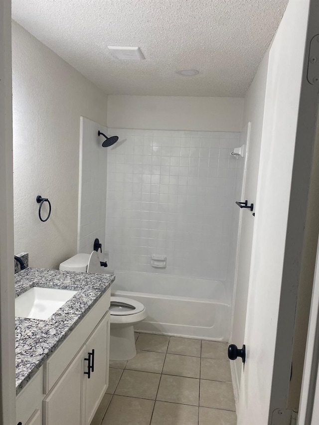 full bathroom featuring vanity, a textured ceiling, tile patterned floors, and toilet