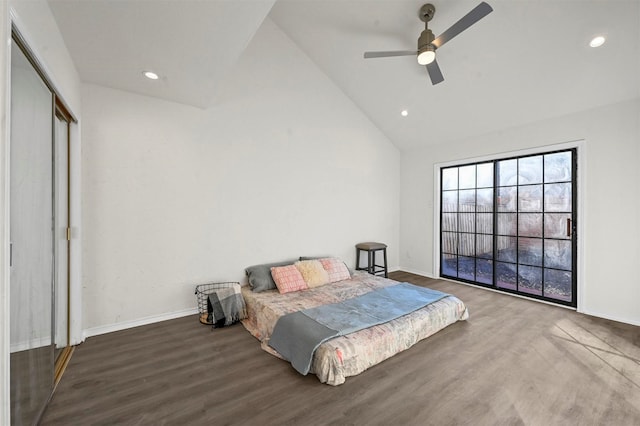 bedroom with dark wood-type flooring, ceiling fan, high vaulted ceiling, and a closet