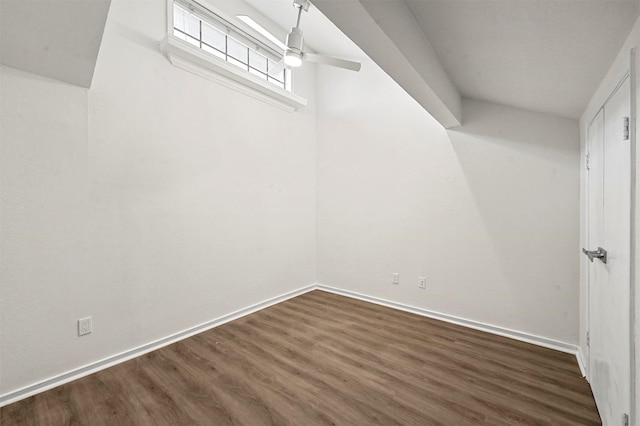 interior space featuring dark wood-type flooring and ceiling fan