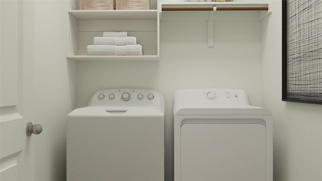 laundry room featuring washing machine and dryer