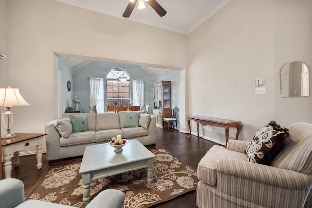 living room featuring ceiling fan, dark wood-type flooring, crown molding, and lofted ceiling