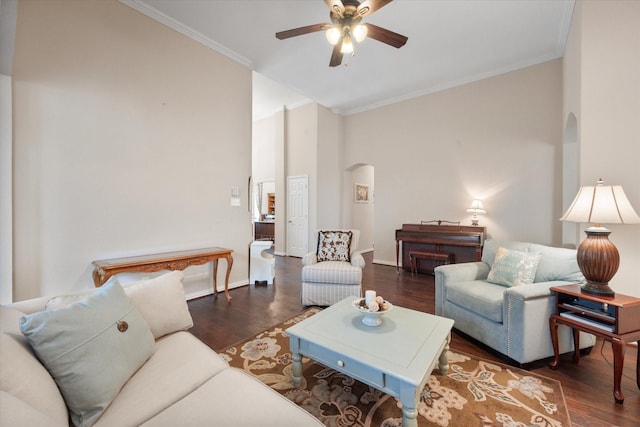 living room with ceiling fan, ornamental molding, and dark hardwood / wood-style flooring