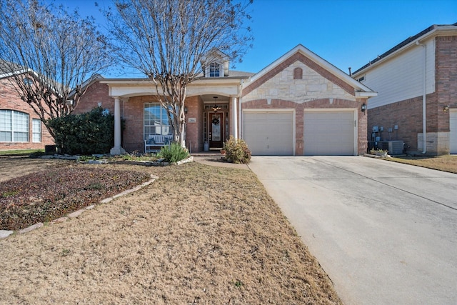 ranch-style home with cooling unit, a garage, and covered porch