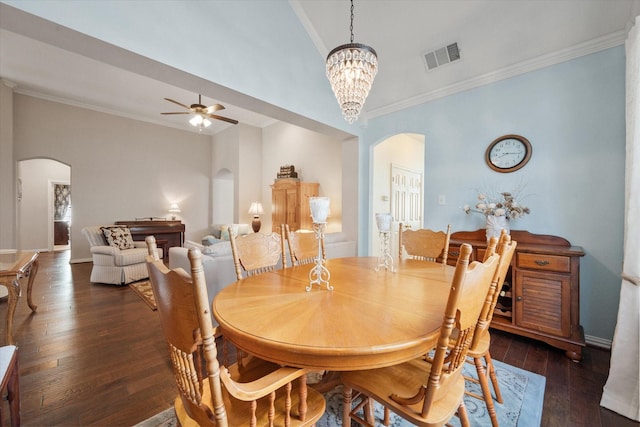 dining area featuring ceiling fan with notable chandelier, crown molding, and dark hardwood / wood-style flooring