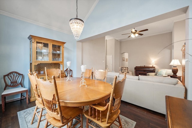 dining area featuring ornamental molding, dark hardwood / wood-style floors, and ceiling fan with notable chandelier