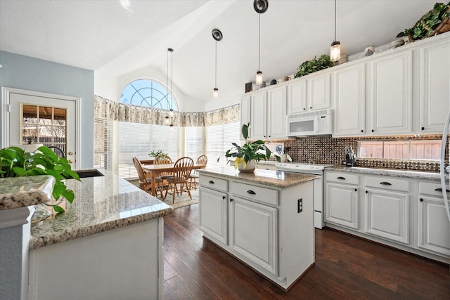 kitchen with white cabinetry, a center island, decorative light fixtures, white appliances, and dark hardwood / wood-style floors