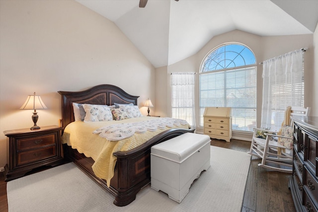 bedroom featuring multiple windows, vaulted ceiling, hardwood / wood-style floors, and ceiling fan