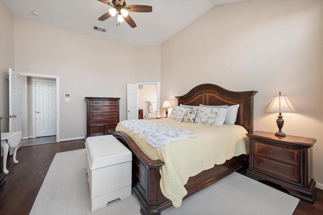 bedroom featuring dark hardwood / wood-style flooring, ceiling fan, and high vaulted ceiling