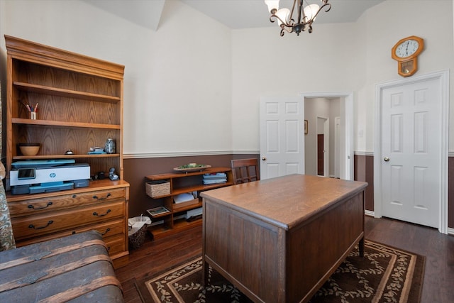 office area with an inviting chandelier and dark hardwood / wood-style flooring