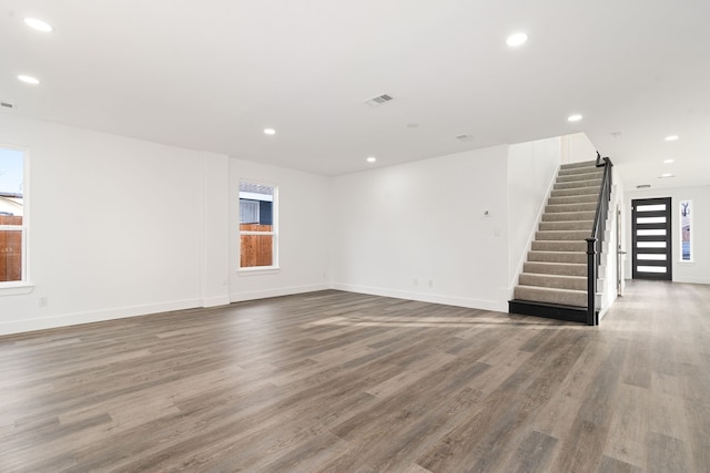 unfurnished living room with hardwood / wood-style flooring