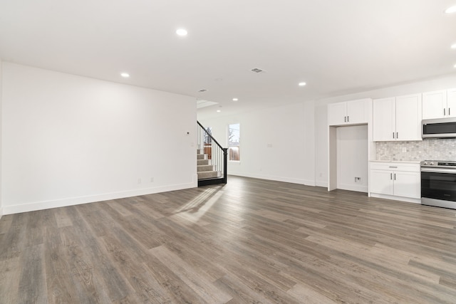 unfurnished living room with hardwood / wood-style floors