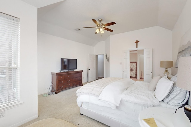 carpeted bedroom featuring vaulted ceiling and ceiling fan