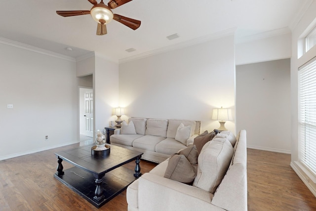 living room featuring hardwood / wood-style flooring, ceiling fan, and ornamental molding