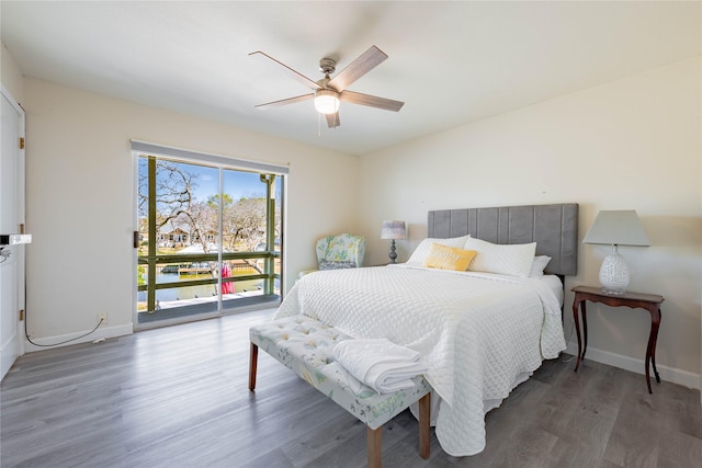 bedroom with ceiling fan and dark wood-type flooring