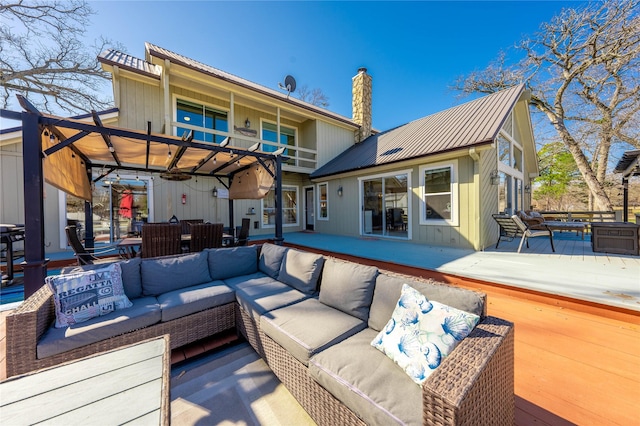 exterior space featuring an outdoor hangout area and a pergola